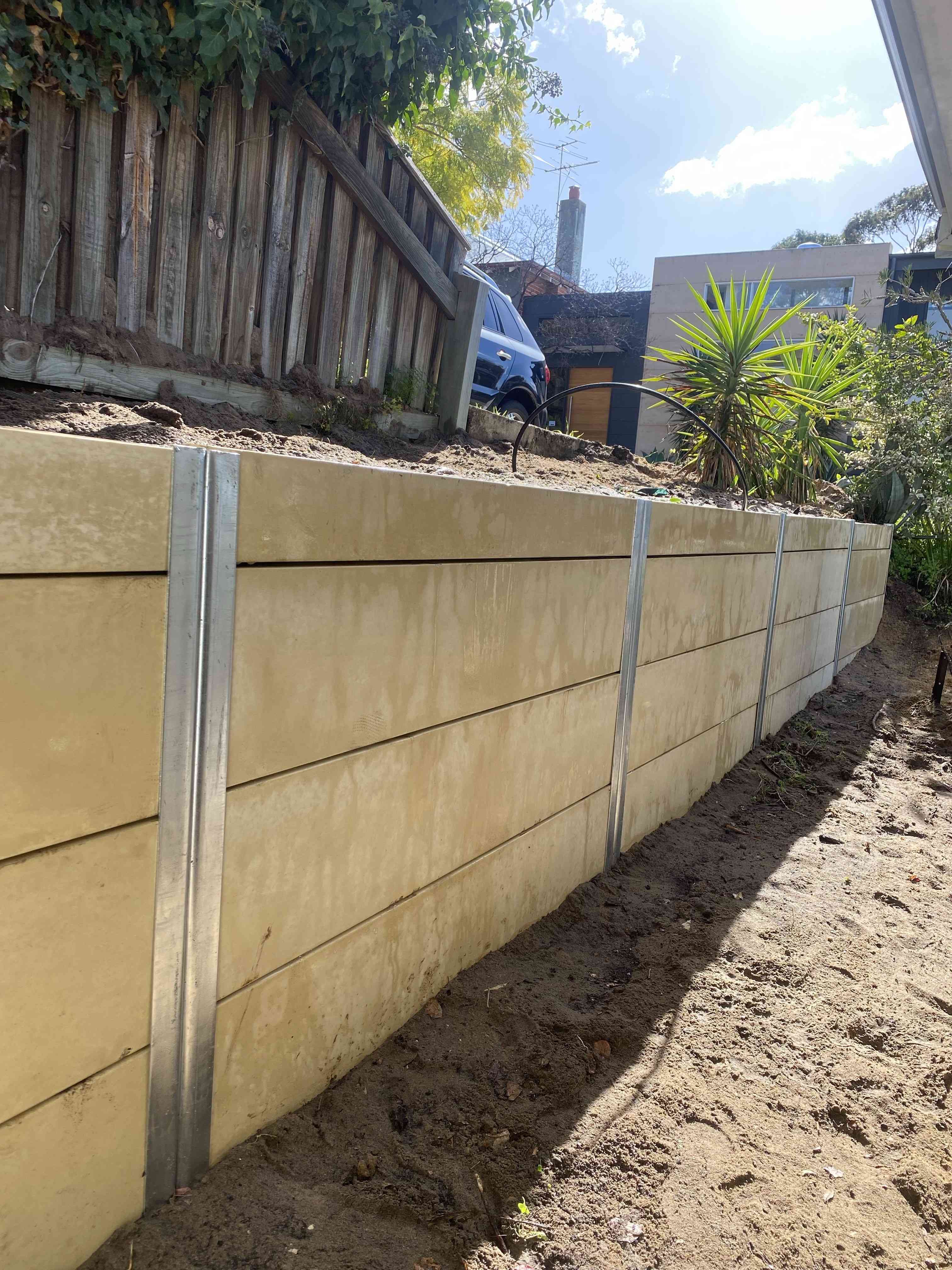 Limestone panel retaining wall with galvanised steel posts, Perth