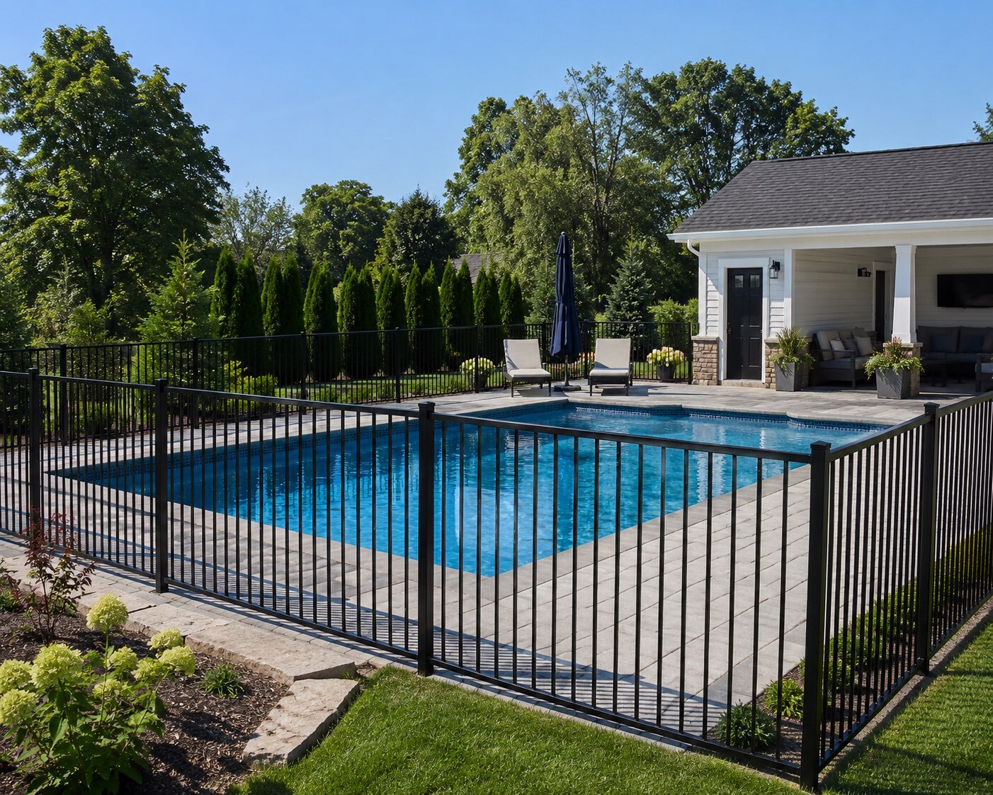Black tubular pool fencing beside a Perth pool