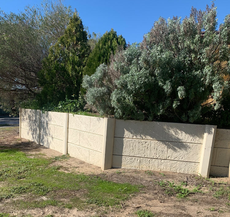 Low limestone retaining wall built for a Perth front garden